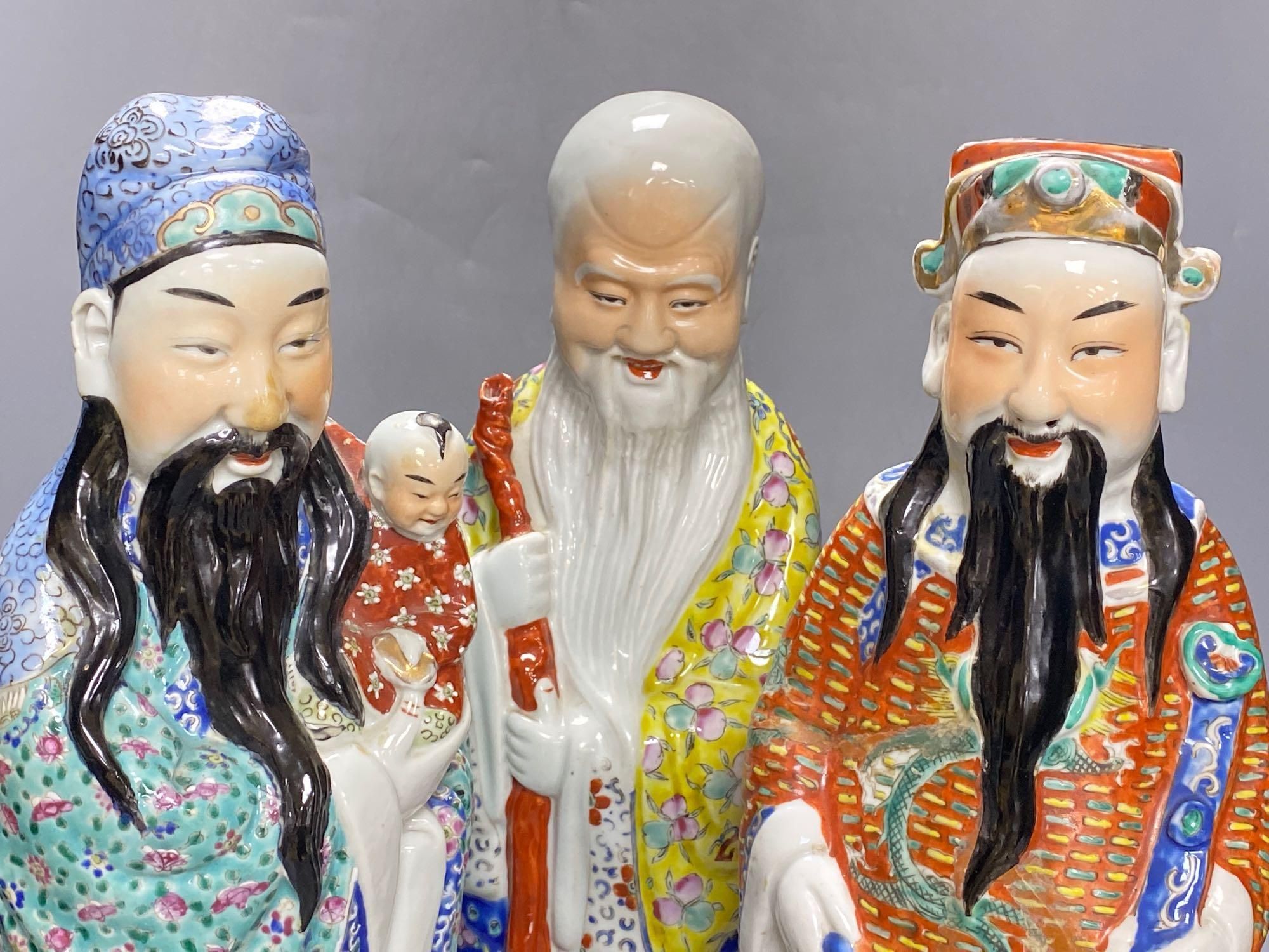 A group of three Chinese porcelain immortals, 47cm